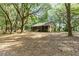 House surrounded by lush, green trees at 9442 Cr 674, Bushnell, FL 33513