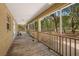 Long wooden screened porch overlooking backyard at 9442 Cr 674, Bushnell, FL 33513