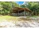 Open-air barn with a chain link fence at 9442 Cr 674, Bushnell, FL 33513