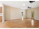 Hardwood floor living room with access to kitchen and other rooms at 9442 Cr 674, Bushnell, FL 33513