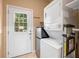 Laundry room with washer, dryer, and exterior access at 9442 Cr 674, Bushnell, FL 33513