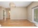 Light-filled dining room with hardwood floors and access to the patio at 9442 Cr 674, Bushnell, FL 33513