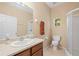 Bathroom with vanity, toilet, and shower at 9442 Cr 674, Bushnell, FL 33513