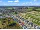 Aerial view of house and surrounding neighborhood at 12599 Ne 49Th Dr, Oxford, FL 34484