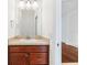 Simple bathroom with a vanity and mirror at 1429 Bluebeard Ct, The Villages, FL 32163