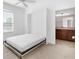 Bedroom with a wall bed, ceiling fan and en-suite bathroom at 1429 Bluebeard Ct, The Villages, FL 32163