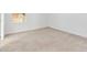 Empty carpeted bedroom with neutral walls and a window at 1429 Bluebeard Ct, The Villages, FL 32163