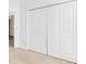 White, four panel closet doors with raised panels at 1429 Bluebeard Ct, The Villages, FL 32163