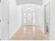 Entryway with tile floors and a glass-paneled front door at 1429 Bluebeard Ct, The Villages, FL 32163
