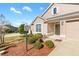 House exterior showcasing a front entrance and landscaping at 1429 Bluebeard Ct, The Villages, FL 32163