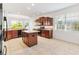 Well-lit kitchen with island, granite countertops, and stainless steel appliances at 1429 Bluebeard Ct, The Villages, FL 32163
