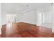 Living room with hardwood floors and views to other rooms at 1429 Bluebeard Ct, The Villages, FL 32163