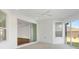 Bright sunroom with sliding glass doors and a ceiling fan at 1429 Bluebeard Ct, The Villages, FL 32163