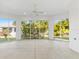 Bright sunroom with sliding glass doors and a ceiling fan at 1429 Bluebeard Ct, The Villages, FL 32163