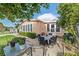 Outdoor patio with table and chairs, ideal for dining al fresco at 1609 Doral Cir, The Villages, FL 32159