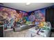 Toy Story themed bedroom with twin beds and murals at 8844 Cruden Bay Ct, Davenport, FL 33896