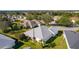 Aerial view showcasing the home's rear and its location in a residential community at 1006 Sayle St, The Villages, FL 32162