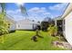 View of the backyard, showcasing a well-maintained lawn at 1006 Sayle St, The Villages, FL 32162