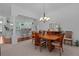 Dining room with a wood table and chairs, hardwood floors at 1006 Sayle St, The Villages, FL 32162