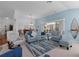 Open living room with a view to the kitchen and dining area at 1006 Sayle St, The Villages, FL 32162