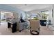 Bright living room with light blue walls and comfortable seating at 1006 Sayle St, The Villages, FL 32162