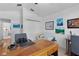 Spacious home office with a desk, chair, and built-in closet at 1006 Sayle St, The Villages, FL 32162