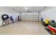 Attached garage with ample space for storage and vehicles at 10286 Julia Isles Ave, Oxford, FL 34484