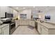 Modern kitchen with stainless steel appliances and an island at 10286 Julia Isles Ave, Oxford, FL 34484