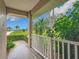 Front porch with white railing offering a view of the backyard at 11036 Cr 229, Oxford, FL 34484