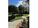 Landscaped walkway and yard with lush green grass and plants at 12144 Bruceton Way # 101, Orlando, FL 32828