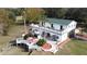 Aerial view of two-story home showcasing a deck, patio, and surrounding landscape at 13131 Mountain Vw, Clermont, FL 34715