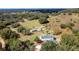 Aerial view showing a house and outbuilding on a spacious lot at 13131 Mountain Vw, Clermont, FL 34715