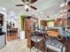 Modern kitchen featuring dark wood cabinets, granite counters, and stainless steel appliances at 13131 Mountain Vw, Clermont, FL 34715