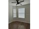 Well-lit bedroom with wood-look floors and ceiling fan at 13584 Turtle Marsh Loop # 132, Orlando, FL 32837