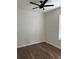 Bright bedroom with wood-look floors and ceiling fan at 13584 Turtle Marsh Loop # 132, Orlando, FL 32837