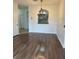 Bright dining area with wood-look flooring and a view into the kitchen at 13584 Turtle Marsh Loop # 132, Orlando, FL 32837
