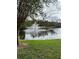 Serene pond with fountain and lush landscaping at 13584 Turtle Marsh Loop # 132, Orlando, FL 32837