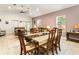 Bright dining room with hardwood floors and a view of the living room at 150 Rose St, Umatilla, FL 32784