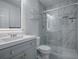 Modern bathroom with gray vanity and glass shower at 1610 Alhambra Way, The Villages, FL 32162