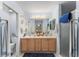 Clean bathroom with double vanity and walk-in shower at 1612 Staunton St, The Villages, FL 32162