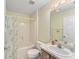 Clean bathroom with a bathtub and shower at 1612 Staunton St, The Villages, FL 32162