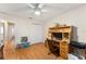 Bedroom with wood flooring and built-in workspace at 1612 Staunton St, The Villages, FL 32162