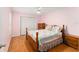 Light pink bedroom with a double bed and wood floors at 1612 Staunton St, The Villages, FL 32162