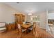 Dining area with wood table and chairs, kitchen access at 1612 Staunton St, The Villages, FL 32162
