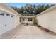 Exterior view of a home with a two-car garage and a side yard at 1612 Staunton St, The Villages, FL 32162