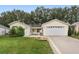 Attractive single story home with a two-car garage and neat landscaping at 1612 Staunton St, The Villages, FL 32162