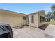 Rear view of the house showing a patio and side entrance at 1612 Staunton St, The Villages, FL 32162