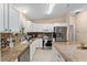 Modern kitchen with granite countertops and stainless steel appliances at 1612 Staunton St, The Villages, FL 32162