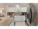 Bright kitchen features granite countertops and stainless steel appliances at 1612 Staunton St, The Villages, FL 32162