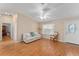 Living area with hardwood floors, sofa, and entryway at 1612 Staunton St, The Villages, FL 32162